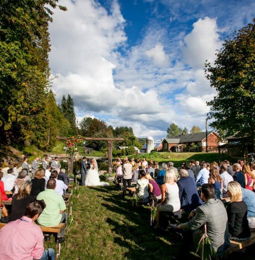 Ceremony by the Pond with Barn in Background